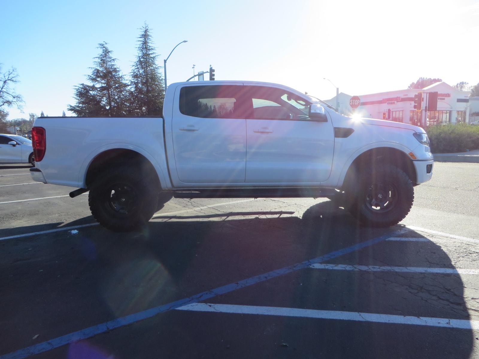 2019 White /Black Ford Ranger Lariat (1FTER4FHXKL) with an 2.3L engine, automatic transmission, located at 2630 Grass Valley Highway, Auburn, CA, 95603, (530) 508-5100, 38.937893, -121.095482 - Features a Fabtech suspension system, Fuel Offroad wheels, Nitto Ridge Grappler tires, Westin Running boards, and a Bakflip. - Photo #3